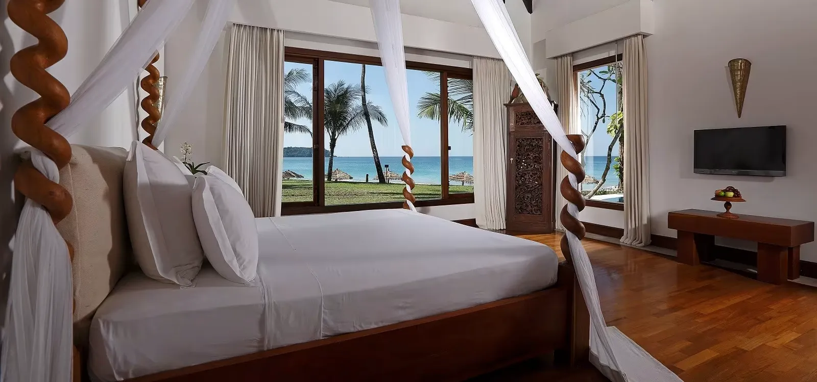 Double-click to enlarge Ngapali Bay villa bedroom, twisted teak posts